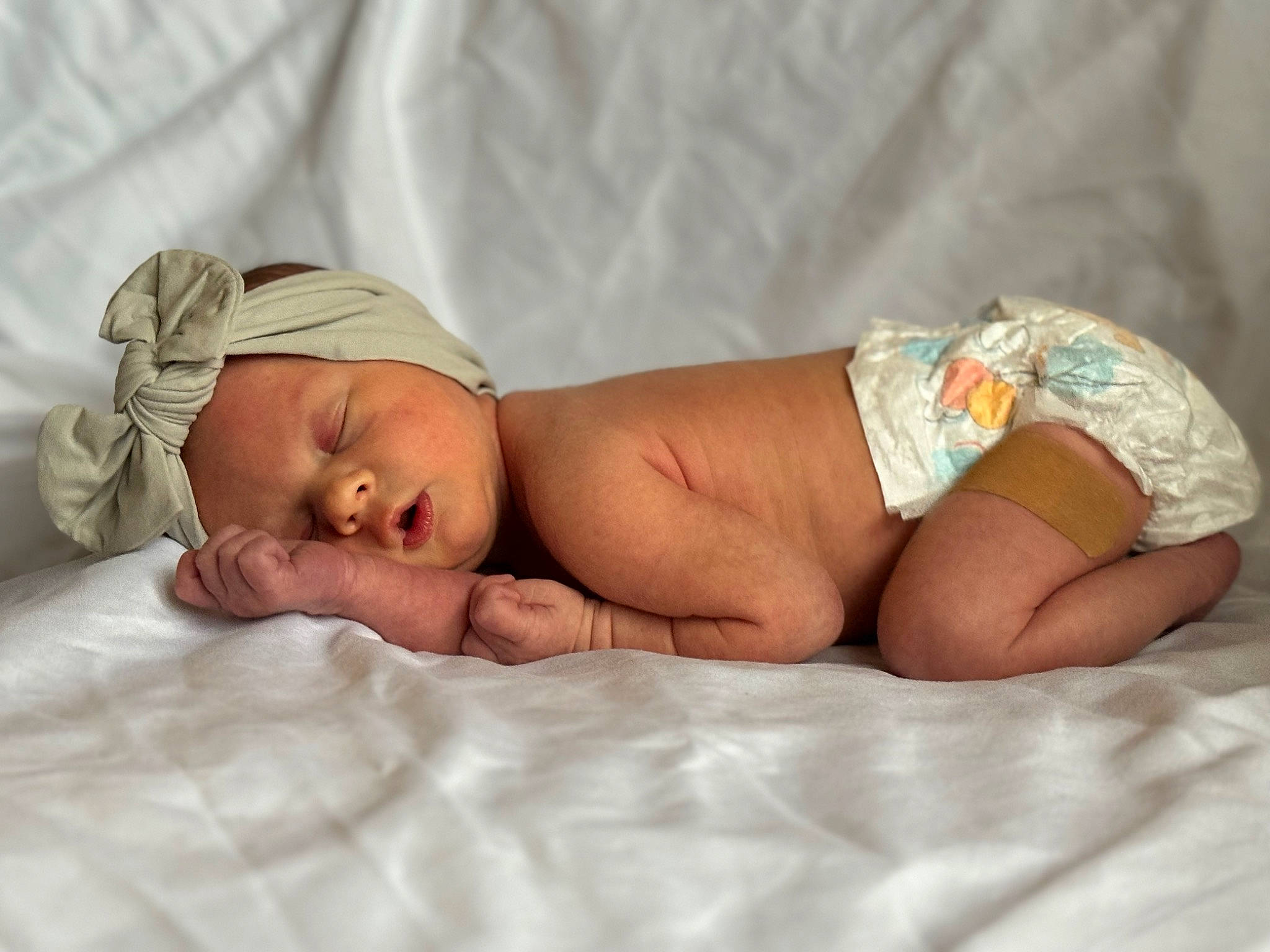 Evangeline joined the competition — help win amazing prizes! abdomen, baby, baby_sleeping, baby_toddler_clothing, child, comfort, diaper, event, flesh, foot, hand, headwear, human_body, human_leg, linens, person, room, service, skin, stomach
