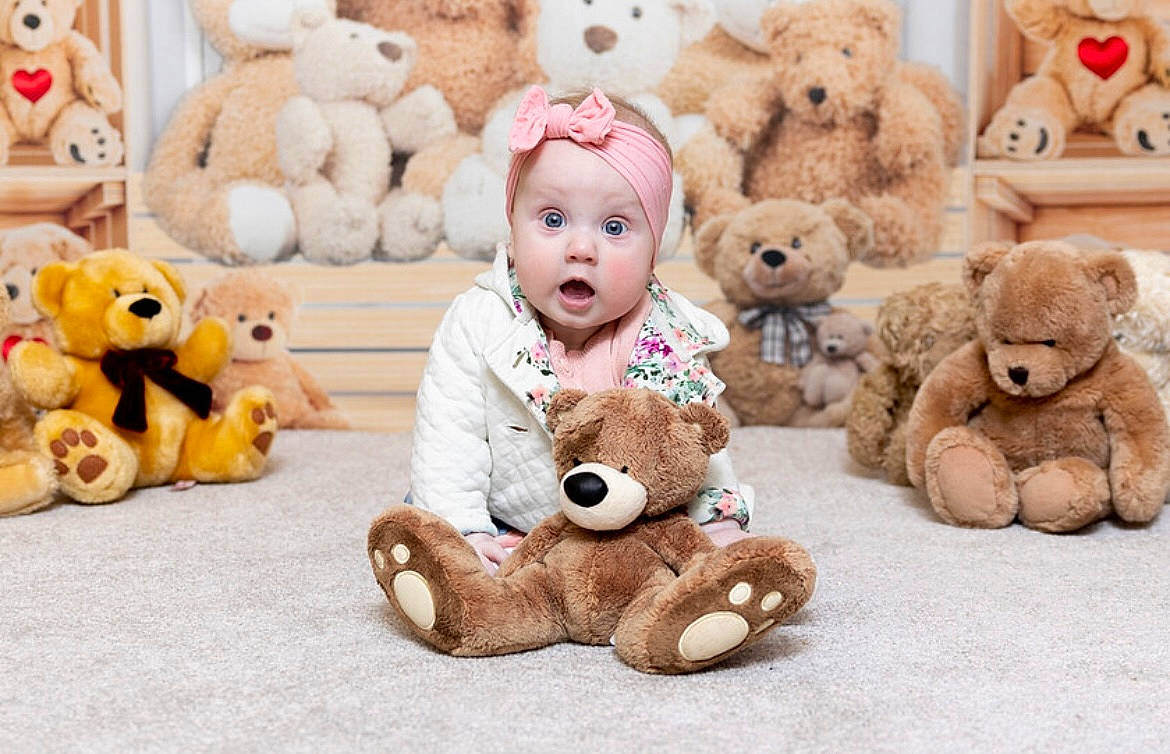Imogen joined the competition — help win amazing prizes! baby, baby_toddler_clothing, baby_toys, child, event, fawn, fur, happy, headwear, mammal, person, photograph, plush, product, skin, smile, stuffed_toy, surprise, teddy_bear, textile