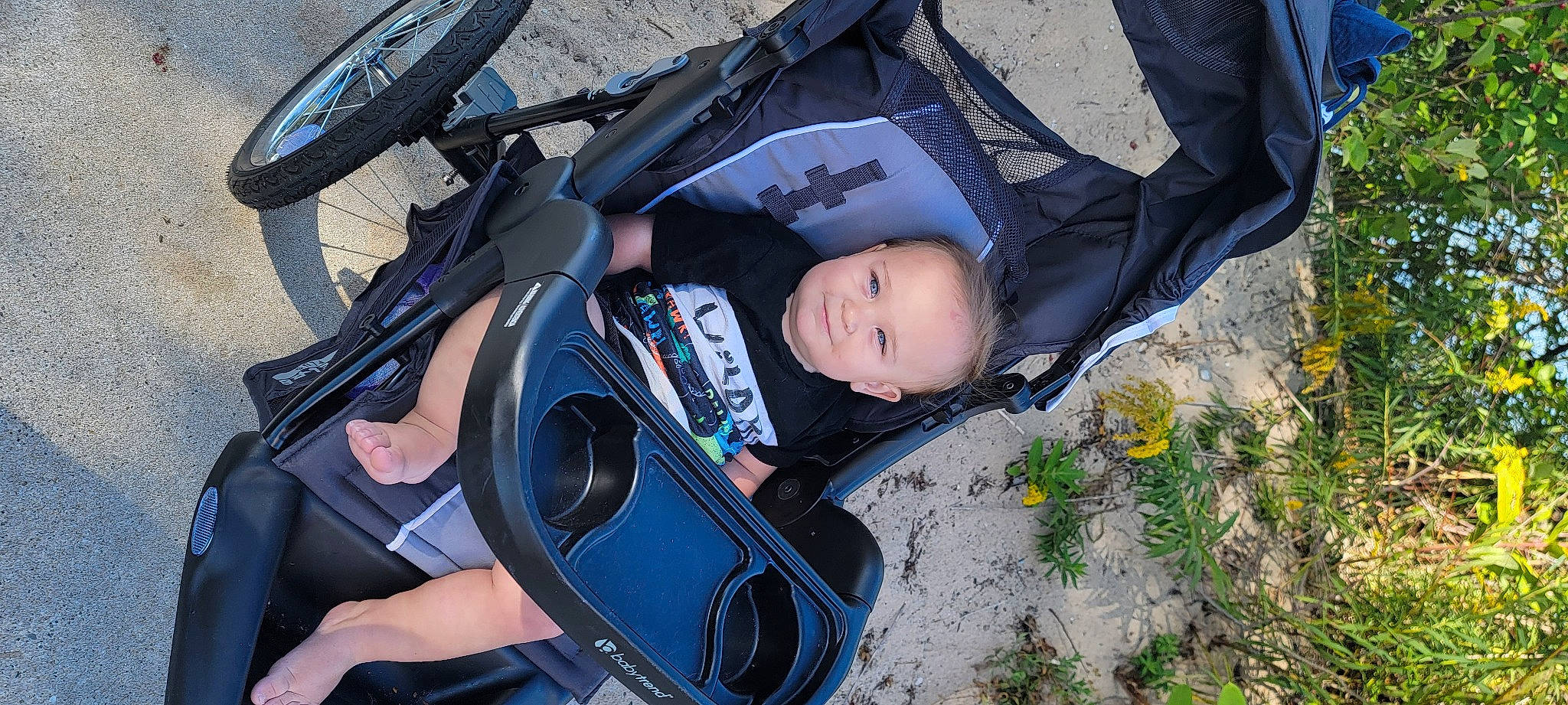 Samuel joined the competition — help win amazing prizes! auto_part, automotive_tire, baby, baby_carriage, baby_products, bag, child, comfort, flower, grass, joy, leisure, motor_vehicle, person, personal_protective_equipment, plant, recreation, sitting, tire, toddler