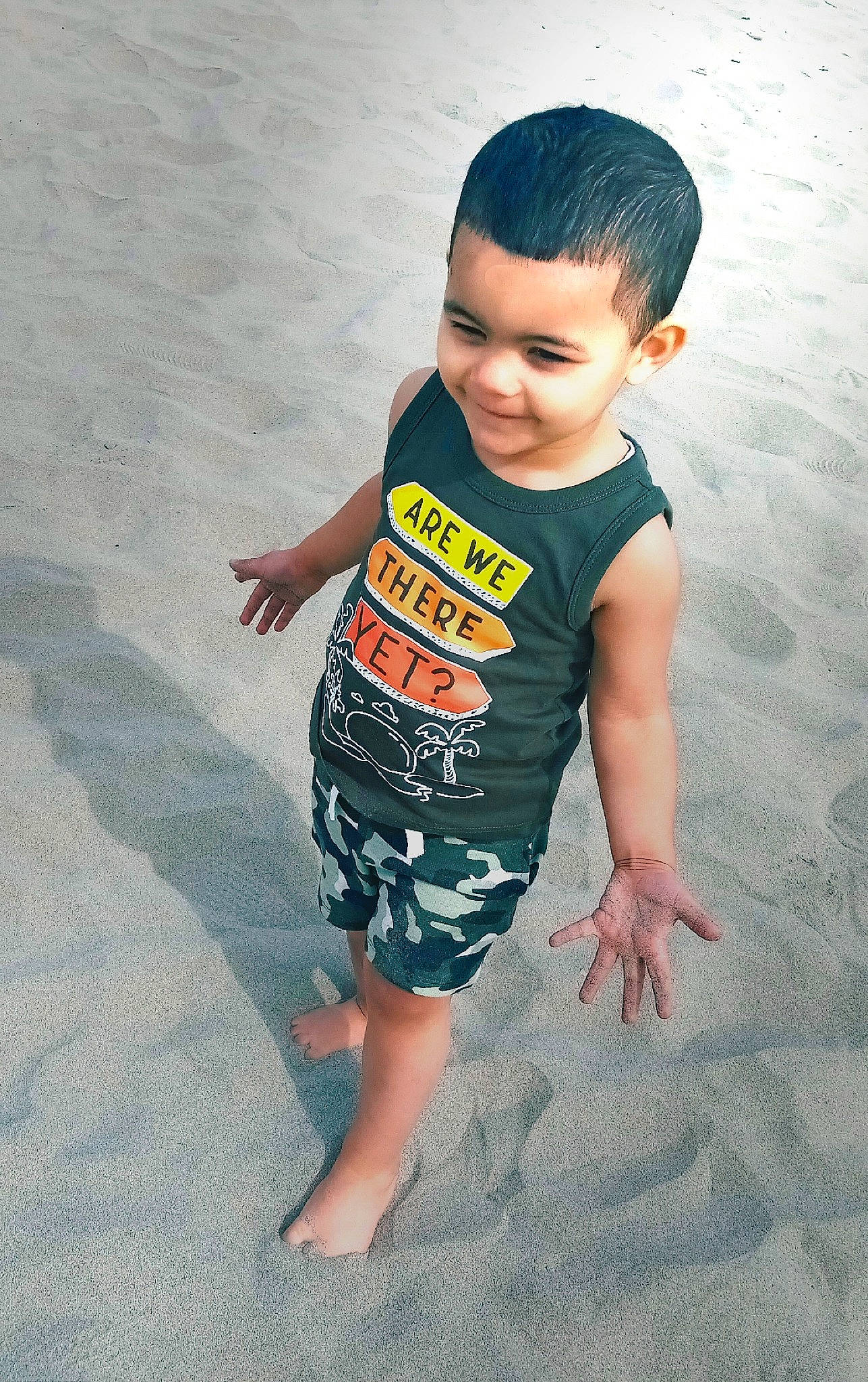 Isaiah is registered to the contest to win money with this photo: baby_toddler_clothing, barefoot, flash_photography, flooring, foot, fun, gesture, hairstyle, happy, head, human_body, human_leg, joy, neck, person, sleeve, t_shirt, thigh, thumb, toddler