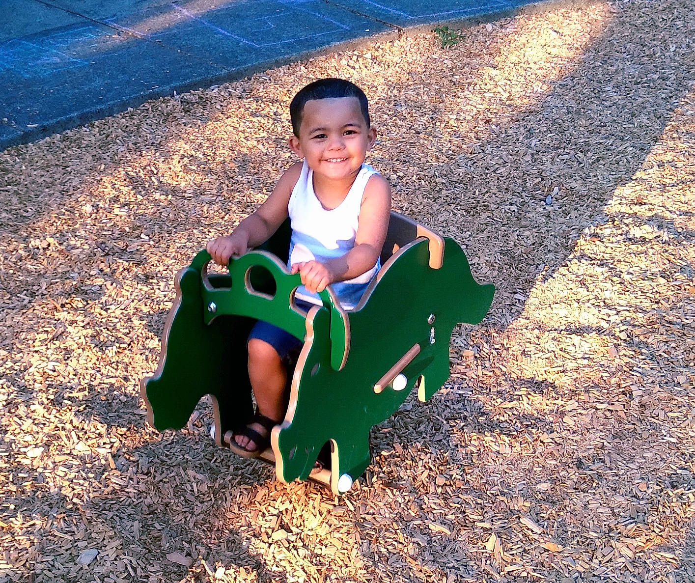 Isaiah joined the competition — help win amazing prizes! asphalt, child, city, electric_blue, face, fun, grass, happy, joy, landscape, leaf, leisure, outdoor_play_equipment, people_in_nature, person, recreation, shade, sitting, smile, soil