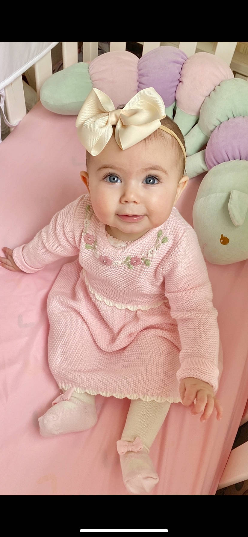 Elisa is registered to the contest to win money with this photo: baby, baby_toddler_clothing, child, child_model, hair_accessory, outerwear, person, pink, skin, sleeve, smile, toddler