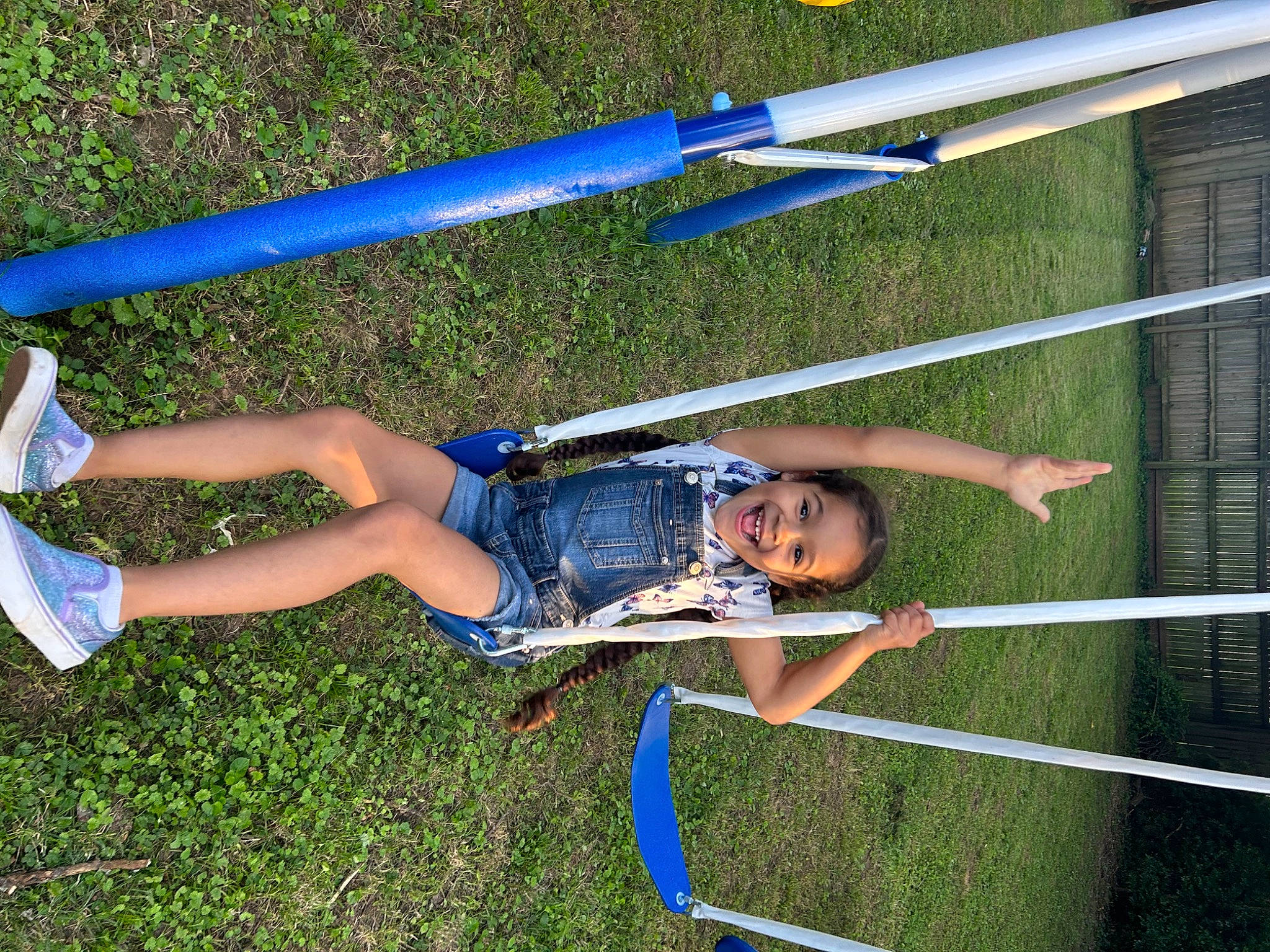 Lunah is registered to the contest to win money with this photo: adventure, competition_event, electric_blue, fun, grass, human_leg, joy, knee, leisure, outdoor_play_equipment, outdoor_recreation, person, play, player, playground, recreation, shorts, smile, sports, thigh