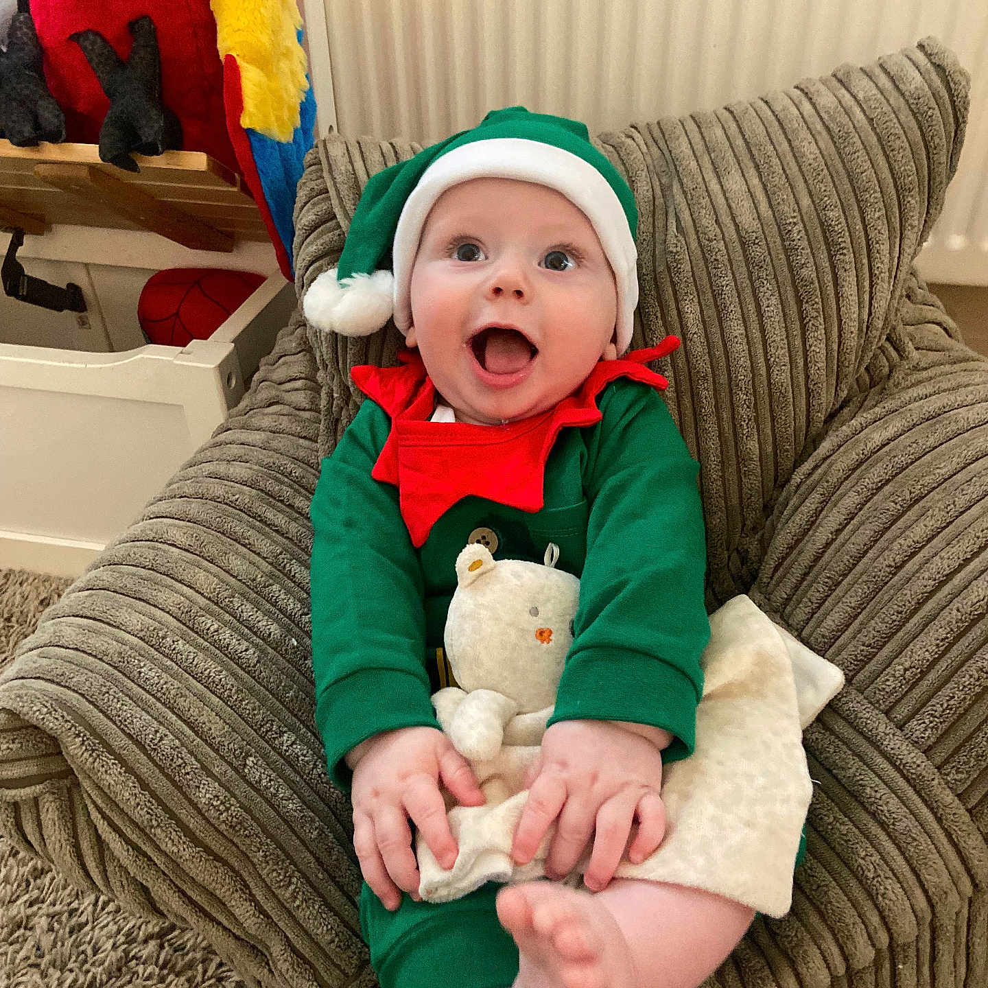 Tommy is registered to the contest to win money with this photo: architecture, baby, building, cap, clothing, coat, costume, couch, cushion, face, furniture, hat, head, homedecor, indoors, livingroom, person, photography, portrait, room