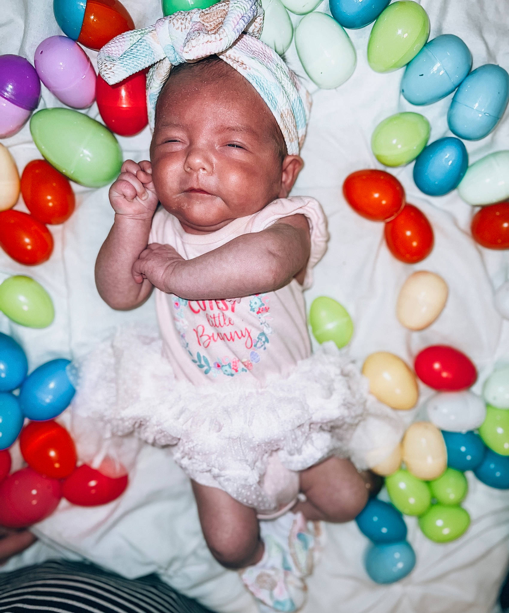 Ashlynn is registered to the contest to win money with this photo: baby, baby_toddler_clothing, ball_pit, balloon, child, event, facial_expression, fun, green, hand, happy, party_supply, people, person, photograph, pink, snapshot, sweetness, toddler, white