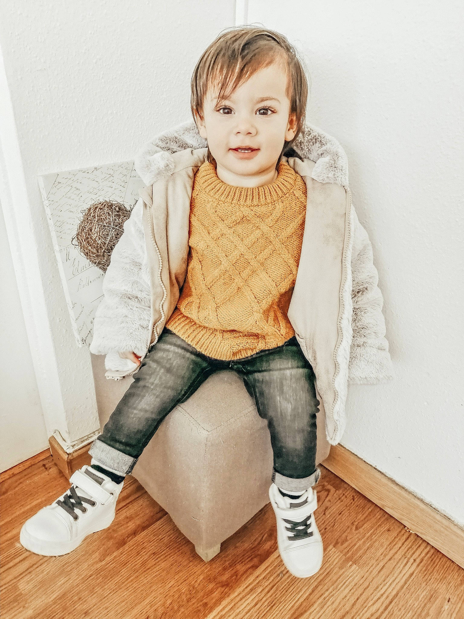Owen participe au concours pour gagner de l'argent avec cette photo : baby_toddler_clothing, beige, child_model, clothing, denim, floor, flooring, fur, hardwood, jacket, jeans, khaki, knee, laminate_flooring, leg, outerwear, person, sleeve, textile, trousers
