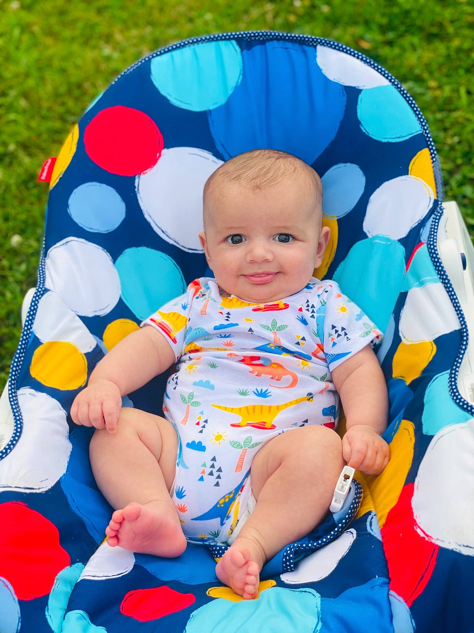 Dawson joined the competition — help win amazing prizes! baby, baby_toddler_clothing, blue, child, comfort, electric_blue, face, fun, grass, happy, head, joy, leisure, pattern, people_in_nature, person, pink, playing_with_kids, sitting, sleeve
