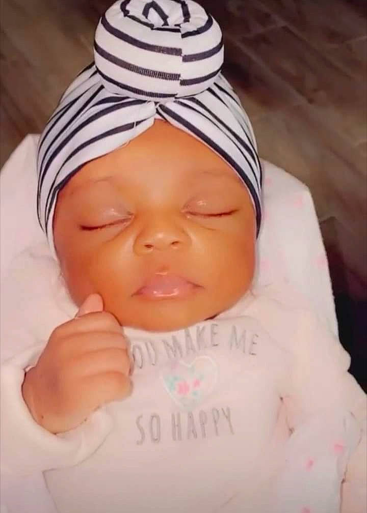 Kiley is registered to the contest to win money with this photo: baby, baby_toddler_clothing, cap, cheek, chin, eye, eyebrow, face, facial_expression, finger, forehead, hand, head, headwear, lip, mouth, nose, person, skin, sleeve