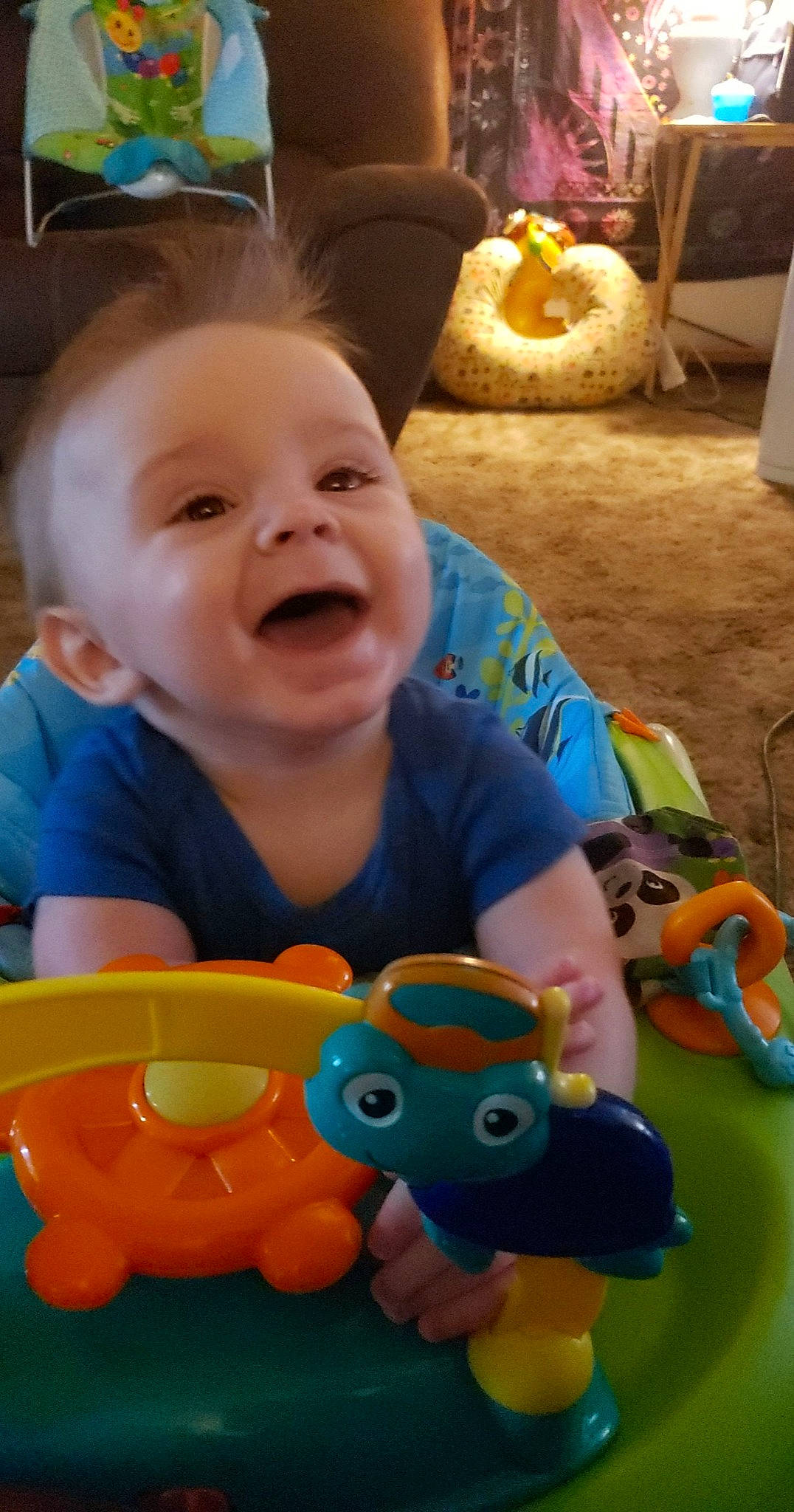 Creed is registered to the contest to win money with this photo: baby, baby_playing_with_toys, baby_toddler_clothing, cheek, child, fun, game_controller, happy, head, mammal, nose, orange, person, photograph, play, smile, snapshot, toddler, toy, vertebrate