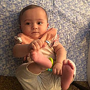 Kaiya is registered to the contest to win money with this photo: baby, infant, child, playful, feet, blanket, blue, clothing, bib, indoor, cute, curious, person, human, skin, hand, foot, carpet, toy, relaxed
