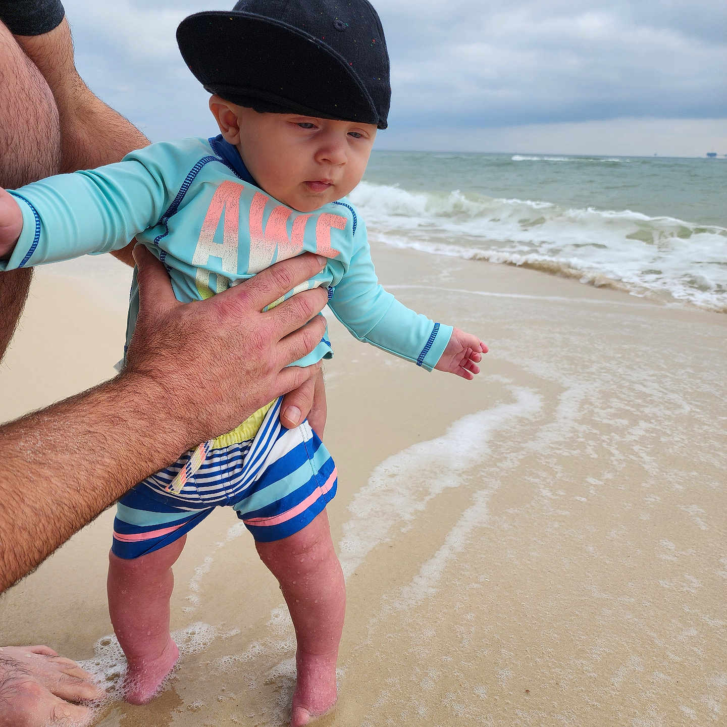Wesley joined the competition — help win amazing prizes! baby, beach, beachwear, bodypart, cap, clothing, coast, face, finger, hat, head, nature, outdoors, person, photography, portrait, sea, shoreline, shorts, water
