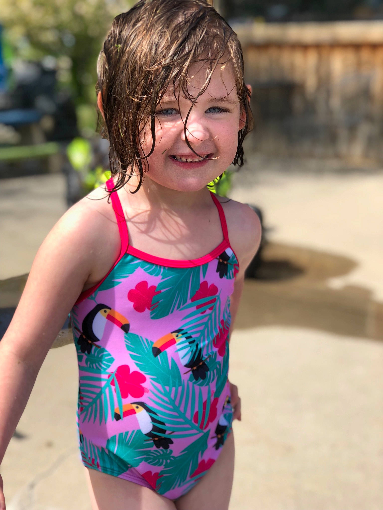 Stella is registered to the contest to win money with this photo: child, clothing, fun, girl, glasses, happiness, joy, person, pink, shorts, smile, summer, sunglasses, swimsuit_top, swimwear, t_shirt, toddler, vacation, vision_care