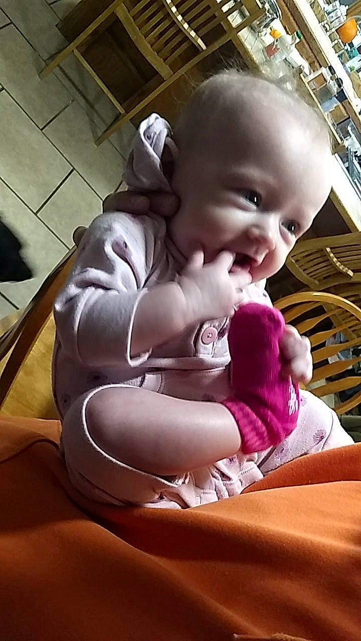 Ezlynn is registered to the contest to win money with this photo: cheek, child, day, eye, fun, girl, infant, leg, person, pink, product, sitting, skin, smile, toddler