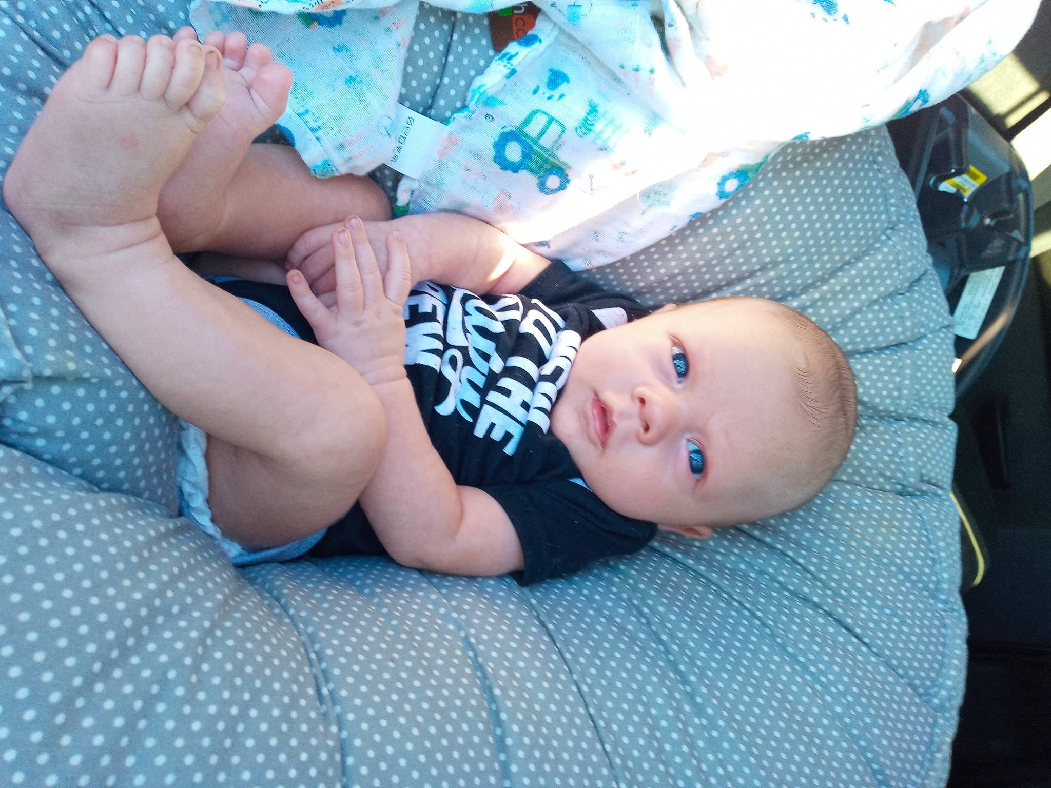 Johnnie is registered to the contest to win money with this photo: baby, baby_toddler_clothing, blue, child, comfort, elbow, electric_blue, finger, flash_photography, foot, grass, human_body, human_leg, knee, mouth, nail, person, skin, thigh, toddler