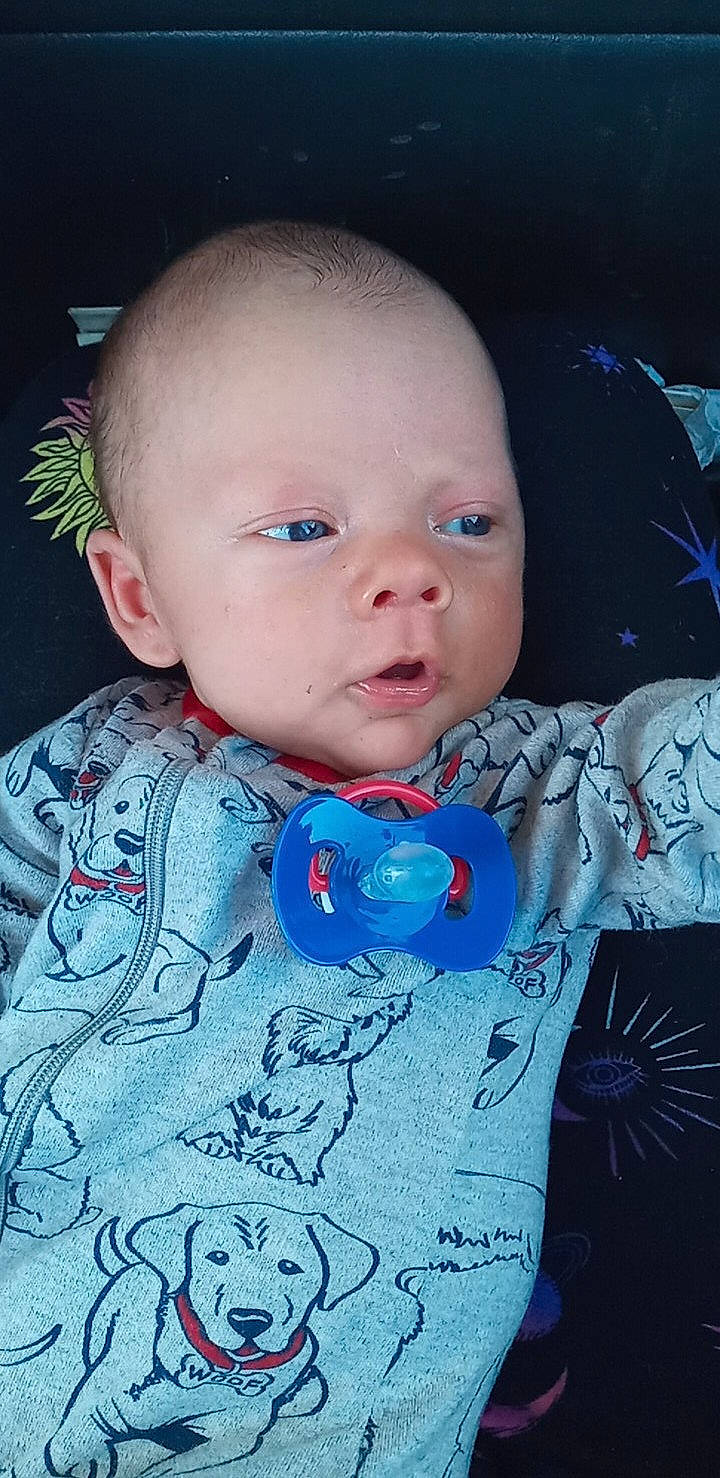 Johnnie is registered to the contest to win money with this photo: baby, baby_toddler_clothing, cheek, chin, dress, ear, head, human, human_body, iris, lip, mouth, neck, nose, outerwear, person, pink, skin, sleeve, standing