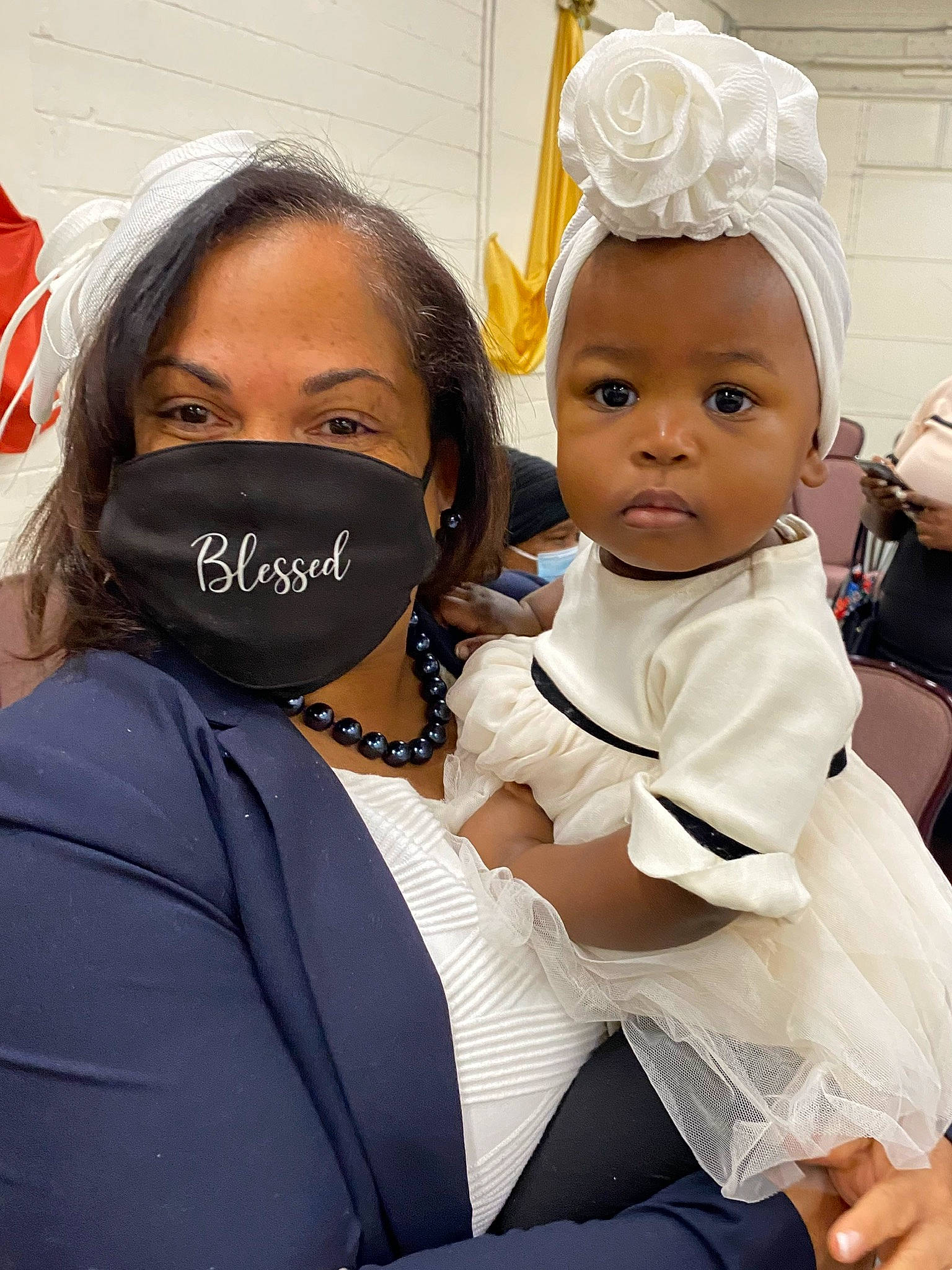 Jolie is registered to the contest to win money with this photo: baby, child, costume, event, eyewear, facial_expression, fashion_accessory, formal_wear, fun, gesture, hairstyle, happy, hat, headband, headpiece, jewellery, necklace, person, skin, toddler