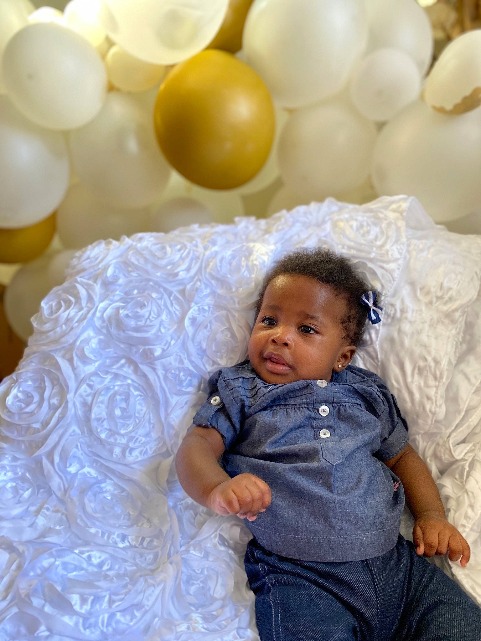 Isabelle is registered to the contest to win money with this photo: baby, baby_toddler_clothing, balloon, decoration, event, facial_expression, fashion, flash_photography, fun, happy, human, organ, party_supply, people, person, photograph, pink, textile, toddler, white