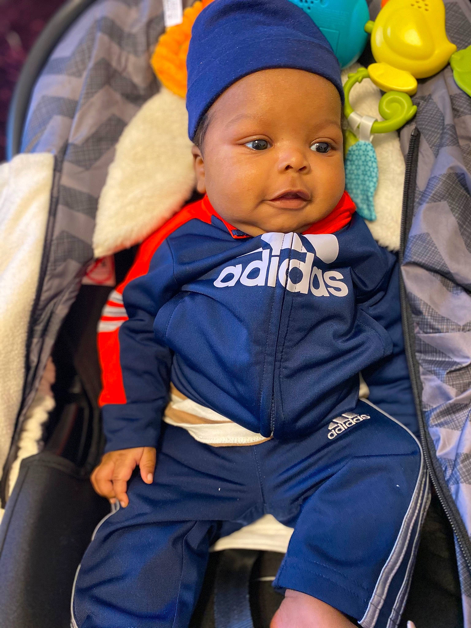 Jalen joined the competition — help win amazing prizes! baby, baby_carriage, baby_products, baby_toddler_clothing, balloon, baseball_cap, cap, car_seat, child, comfort, electric_blue, fun, happy, headgear, headwear, leisure, orange, person, shorts, sitting