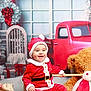 Hudson joined the competition — help win amazing prizes! baby, child, santa_claus_costume, red_clothing, smiling, holiday, christmas, decorations, toy_truck, plush_bunny, gift_boxes, furry_stool, festive, indoor, cute, happy, seasonal, holiday_spirit, portrait, sitting