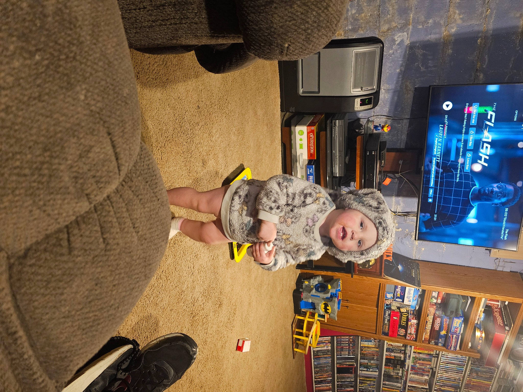 Thea joined the competition — help win amazing prizes! audio_equipment, child, display_device, flooring, foot, fun, gadget, games, headwear, machine, person, play, recreation, recreation_room, room, space, television_set, tire, toddler, toy