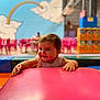 baby, background, child, clouds, colorful, cushion, cute, fun, furniture, happy, indoor, mural, person, pink, play, playground, rainbow, seated, smiling, young_child