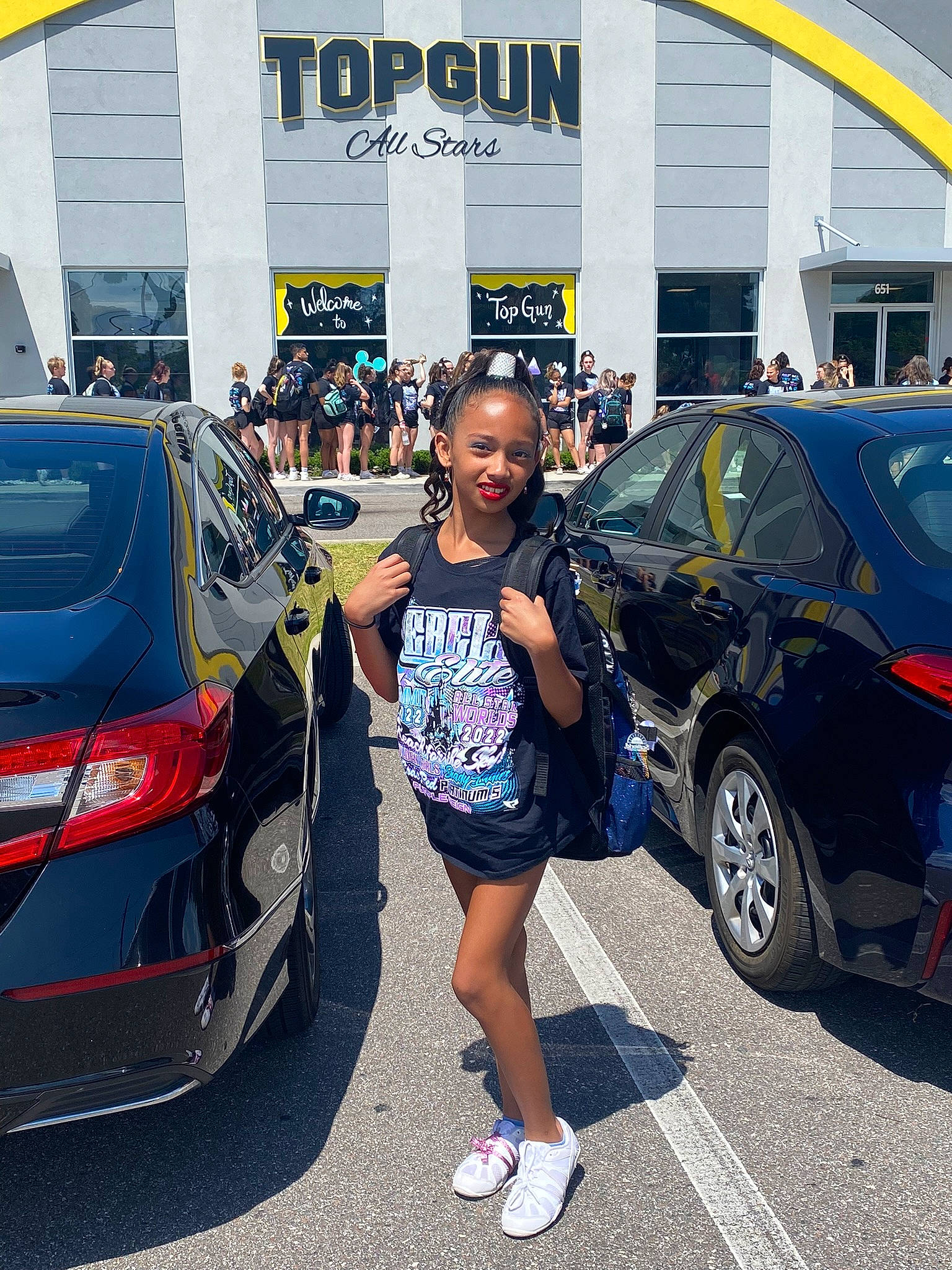 Leah joined the competition — help win amazing prizes! alloy_wheel, asphalt, automotive_design, automotive_exterior, automotive_lighting, automotive_tire, bumper, car, joy, land_vehicle, mode_of_transport, motor_vehicle, parking, person, personal_luxury_car, public_space, rim, tire, trunk, vehicle