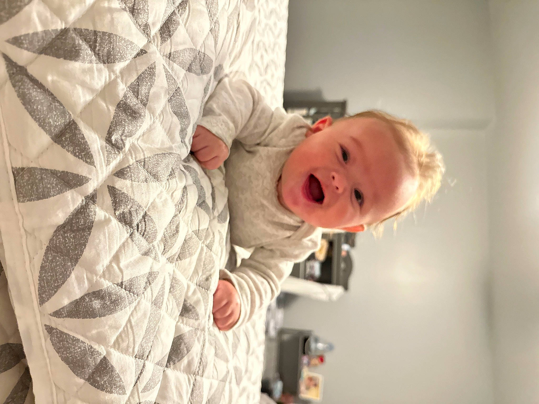 Dayton joined the competition — help win amazing prizes! baby, bedding, child, comfort, couch, floor, flooring, happy, human_body, linens, pattern, person, pillow, room, shoulder, smile, toddler, wood