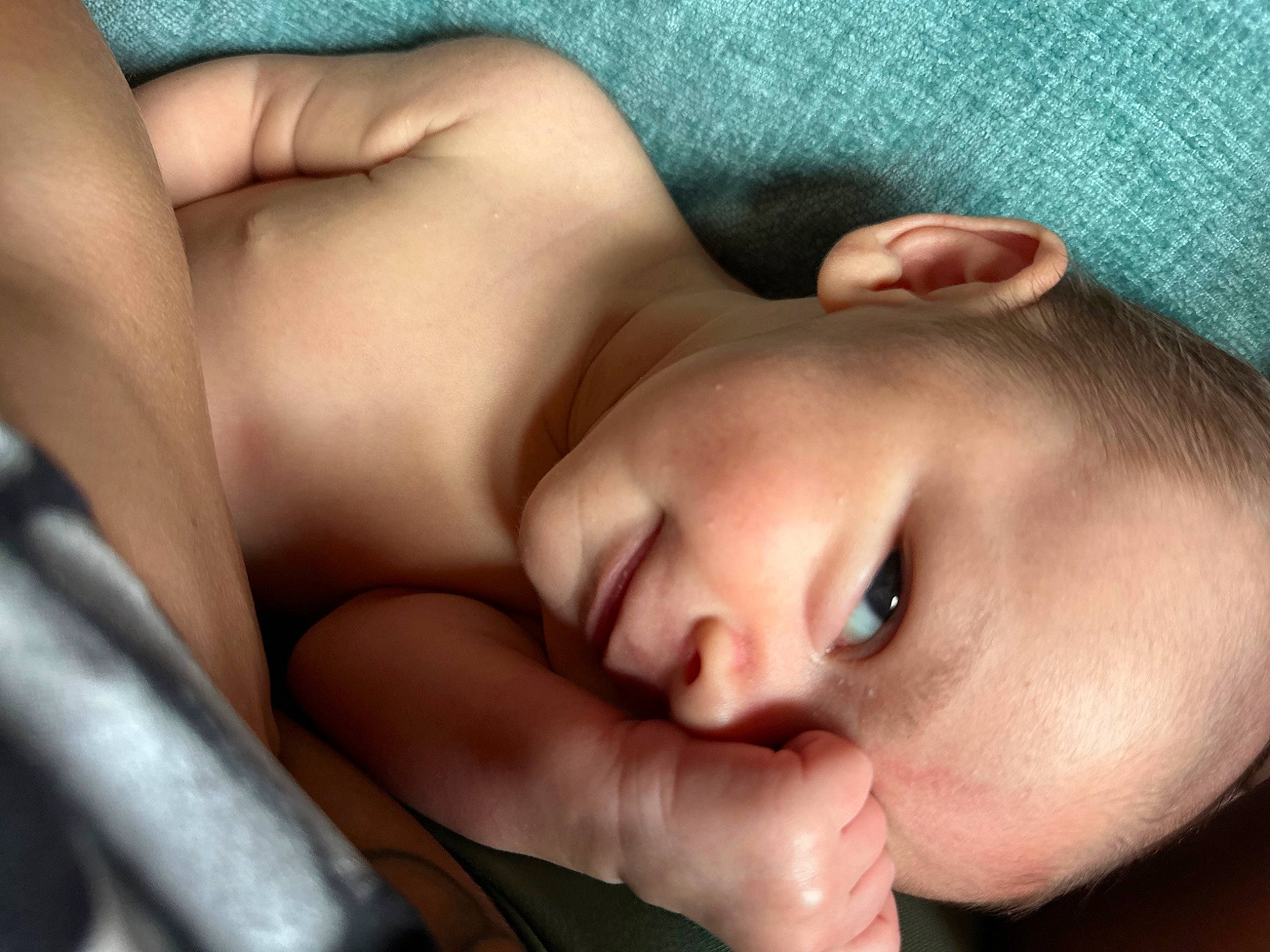 Iverson is registered to the contest to win money with this photo: abdomen, baby, cheek, chest, child, close_up, comfort, eyelash, finger, flesh, gesture, happy, human_leg, lip, mouth, muscle, nose, person, skin, thumb