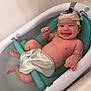 baby, bathtub, bath_time, child, foam, happy, head, indoors, joyful, mesh_seat, person, playful, smile, soap, water, wet, young_child, skin, cute, relaxing