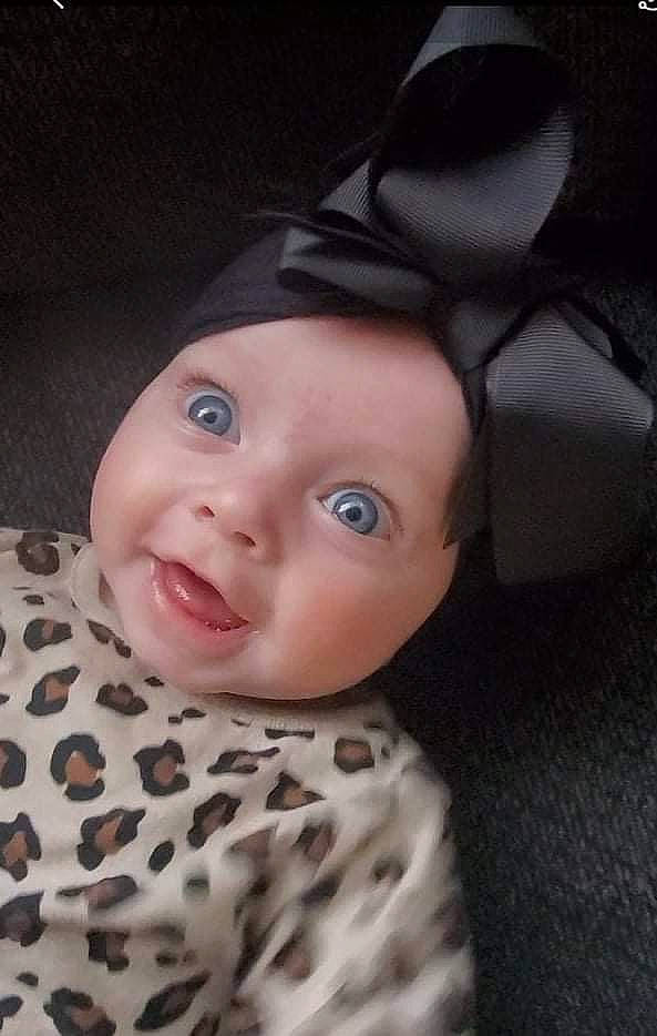 Blakelyn is registered to the contest to win money with this photo: baby, baby_toddler_clothing, cap, cheek, child, dress, eye, eyebrow, eyelash, flash_photography, grey, hat, headgear, headwear, iris, linens, lip, nose, person, sleeve