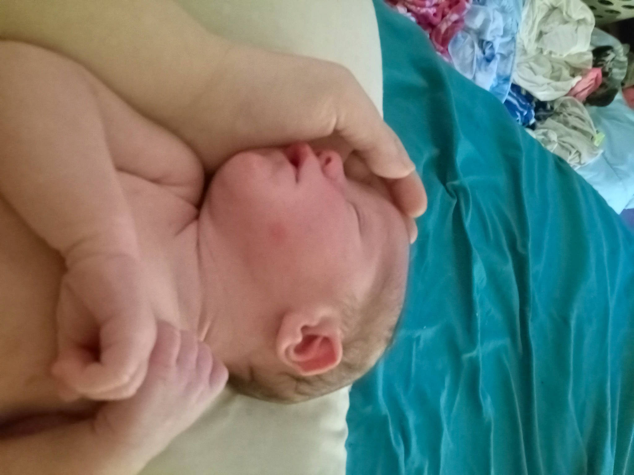 Hugh is registered to the contest to win money with this photo: baby, baby_products, cheek, child, close_up, comfort, event, finger, gesture, hand, linens, mouth, nail, pattern, person, plastic_bag, product, service, skin, thumb