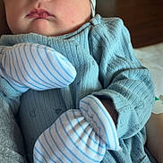 Stetson joined the competition — help win amazing prizes! baby, beanie, blue_clothing, child, close_up, cozy, cute, face, hands, headwear, indoor, infant, mittens, newborn, peaceful, person, portrait, resting, sleeping, soft_light