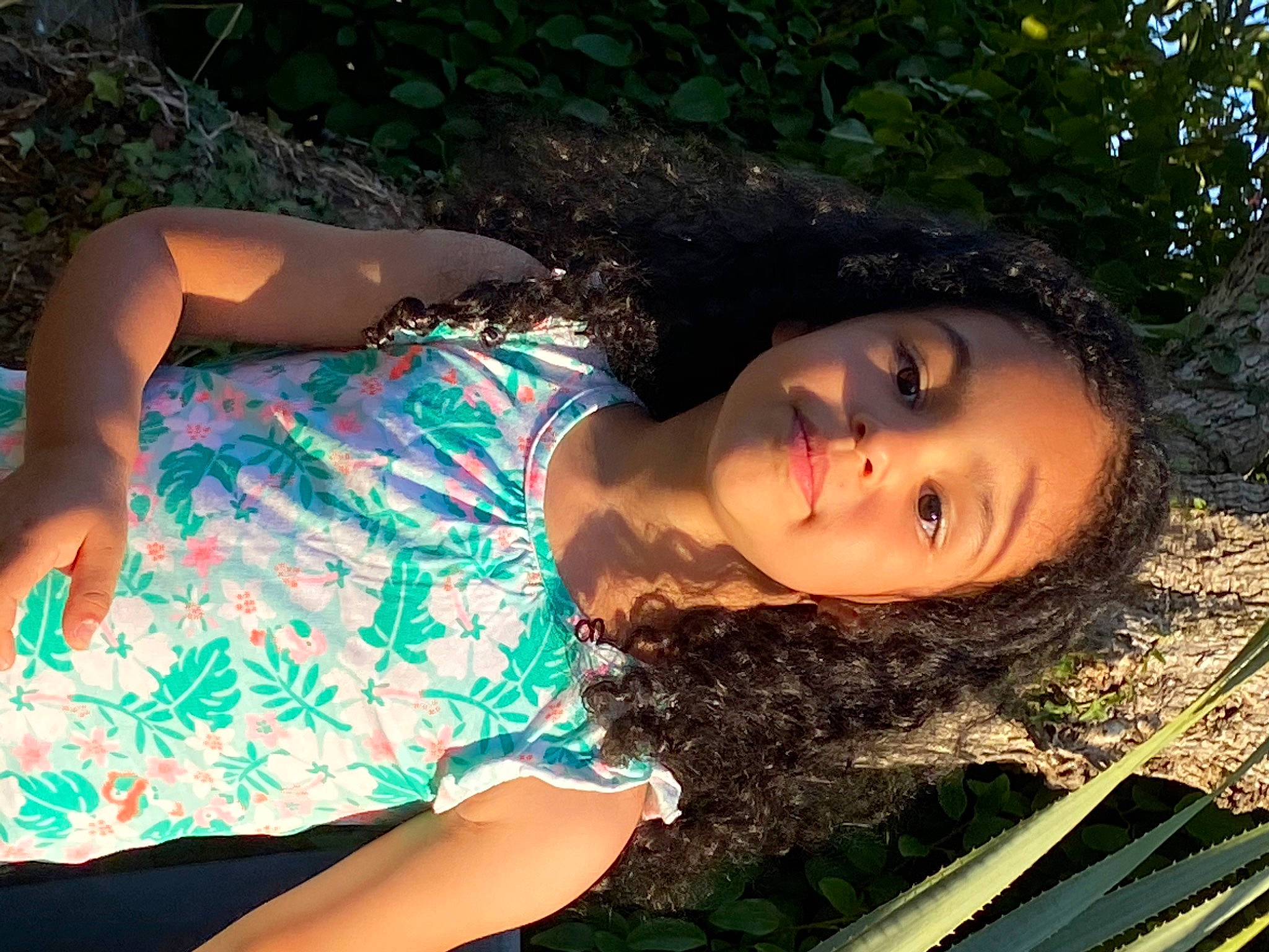 Lahna participe au concours pour gagner de l'argent avec cette photo : abdomen, black_hair, cool, facial_expression, flash_photography, fun, grass, green, happy, human_leg, leisure, long_hair, pattern, people_in_nature, person, skin, sunlight, thigh, tints_and_shades, trunk