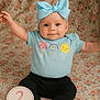 Line is registered to the contest to win money with this photo: 2_months, baby, black_pants, blue_bow, celebration, child, cute, floral_blanket, happy, headband, ice_cream_graphic, indoors, infant, milestone_sign, portrait, sitting, smiling, tshirt, white_socks, young_child