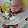Line is registered to the contest to win money with this photo: baby, sleeping, blanket, infant, cozy, face, head, cute, newborn, soft, child, wrapped, patterned_background, peaceful, resting, clothing, indoors, closeup, portrait, warm