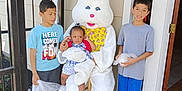 Alina Ebanks joined the competition — help win amazing prizes! child, children, easter_bunny, mascot, costume, porch, doorway, light, outdoor, concrete, sneakers, plastic_bag, smile, curious, family, holiday, fun, spring, celebration, person