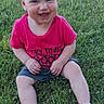 baby, child, grass, outdoor, smiling, happy, sitting, pink_shirt, shorts, barefoot, sunlight, nature, playful, toddler, portrait, young_child, casual_clothing, summer, greenery, cute