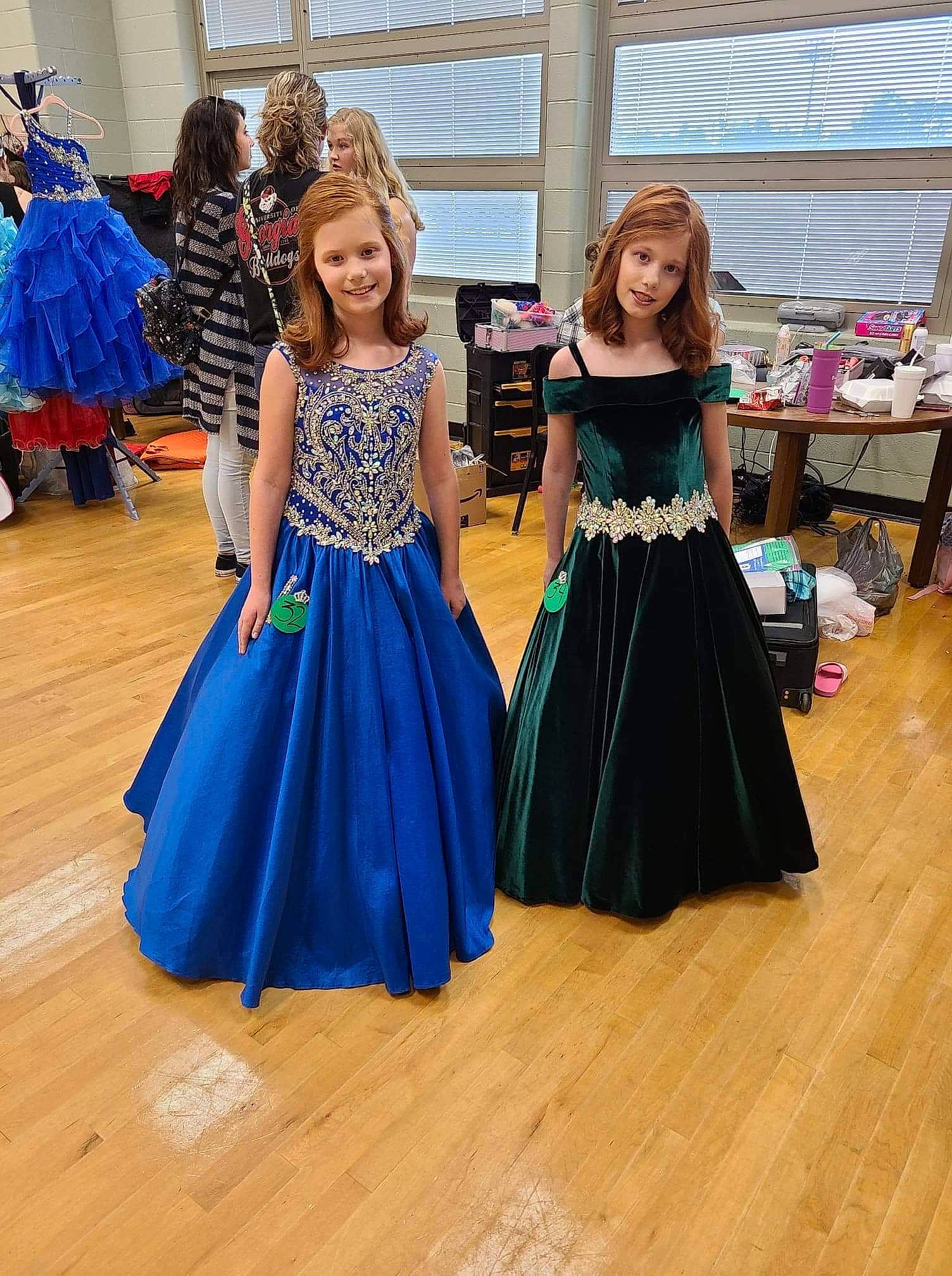 Estella B. is registered to the contest to win money with this photo: abdomen, belt, costume, dress, electric_blue, entertainment, event, fashion_design, flooring, formal_wear, fun, gown, hardwood, joy, magenta, one_piece_garment, performing_arts, person, smile, trunk