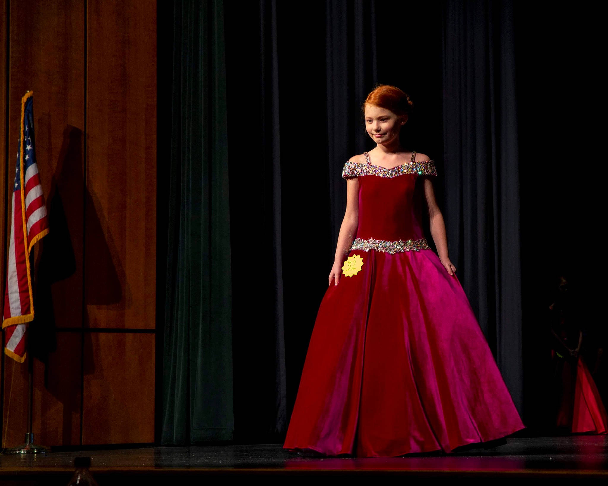 Estella B. joined the competition — help win amazing prizes! abdomen, costume_design, curtain, day_dress, entertainment, event, fashion_design, fashion_model, fashion_show, flag, flag_of_the_united_states, flooring, formal_wear, gown, haute_couture, joy, magenta, one_piece_garment, performance_art, performing_arts