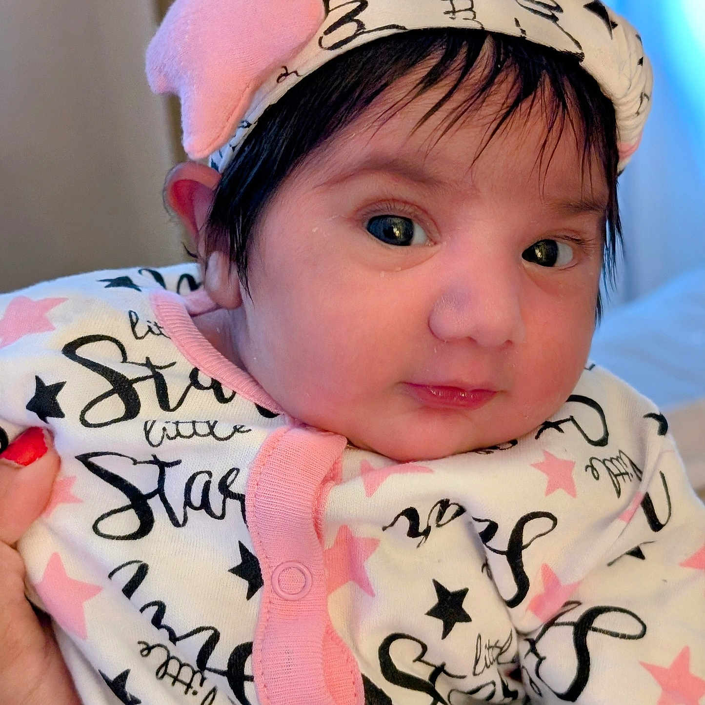 Mehrimah is registered to the contest to win money with this photo: accessories, baby, bodypart, bonnet, cap, clothing, face, finger, hand, hat, head, headband, hoodie, knitwear, newborn, person, photography, portrait, sweater, sweatshirt