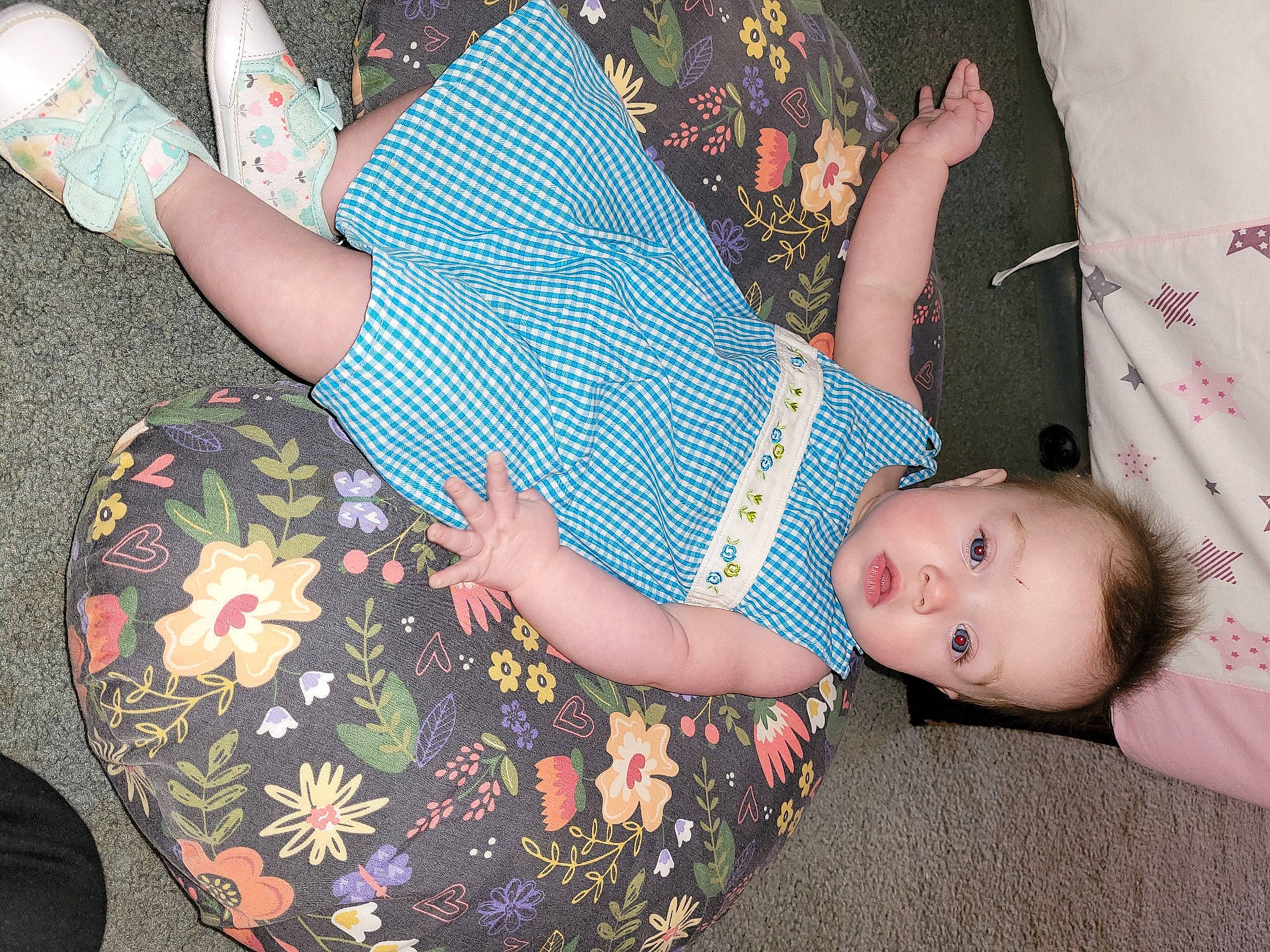Elizabeth is registered to the contest to win money with this photo: arm, baby, baby_toddler_clothing, comfort, creative_arts, finger, hand, human_body, human_leg, joint, lap, leg, nail, pattern, person, pink, sitting, sleeve, thigh, toddler