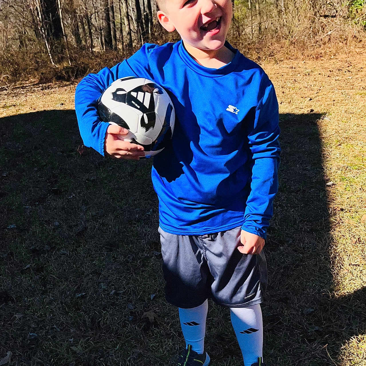 Ezra joined the competition — help win amazing prizes! ball, boy, child, clothing, face, football, footwear, grass, head, male, person, photography, portrait, shoe, shorts, soccer, soccerball, soil, sport, t_shirt