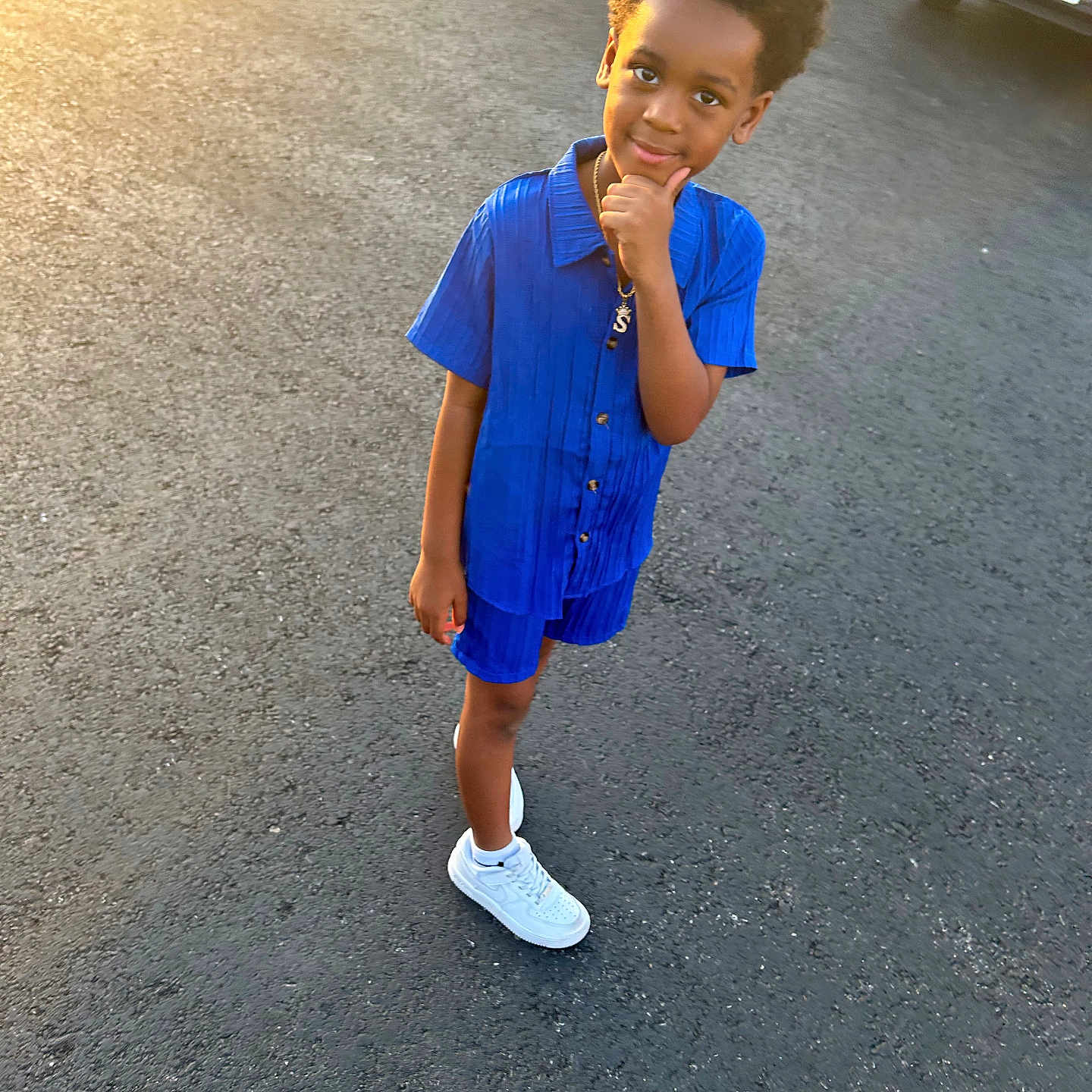 Shukur Jr. is registered to the contest to win money with this photo: bodypart, boy, car, child, clothing, face, footwear, happy, head, male, pants, person, photography, portrait, shoe, shorts, sleeve, smile, transportation, vehicle