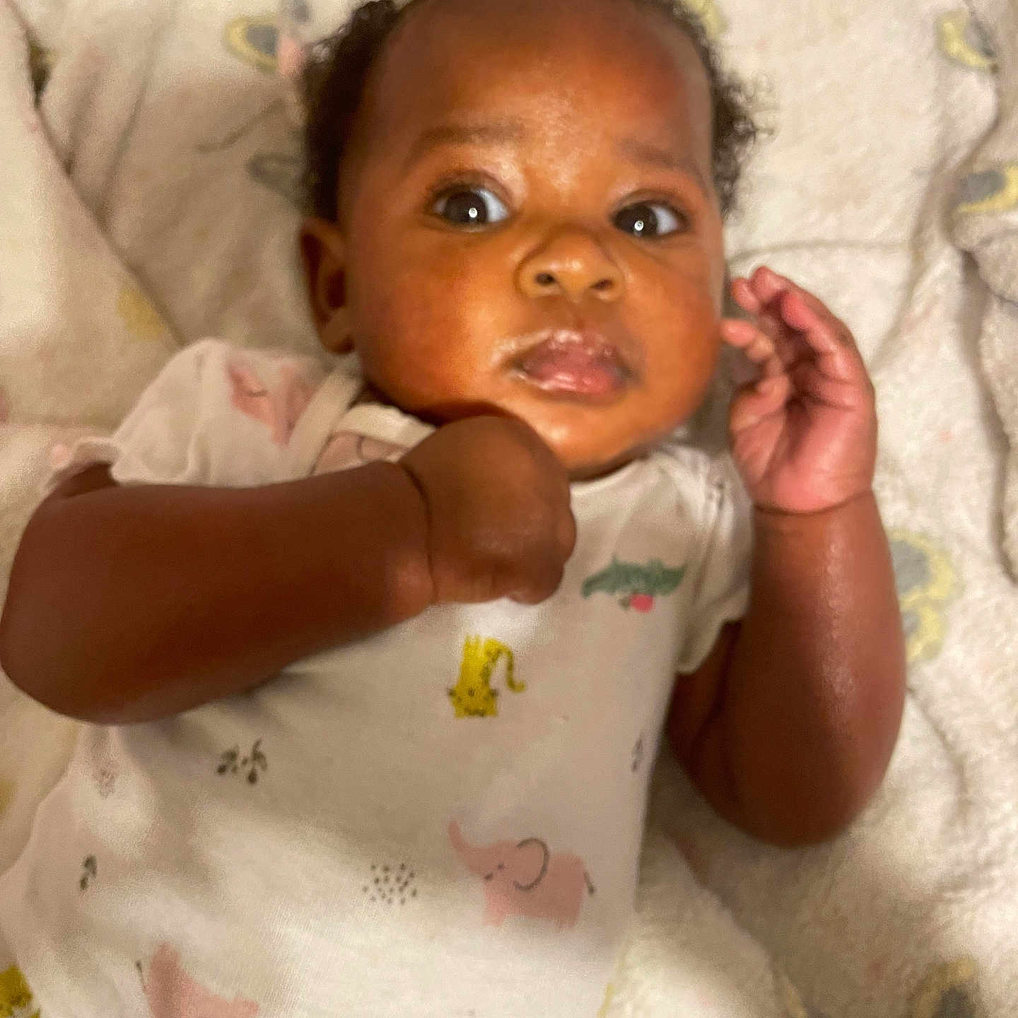 Nature Jaylani is registered to the contest to win money with this photo: arm, baby, babylaughing, bed, biting, blanket, bodypart, face, finger, furniture, hand, happy, head, newborn, person, photography, portrait, quilt, smile, wrist