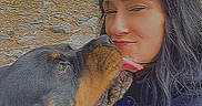 Freedom is registered to the contest to win money with this photo: affection, collar, dog, eyes_closed, face, jacket, landscape, licking, long_hair, outdoor, pet, portrait, riverside, rocks, rottweiler, selfie, shoreline, smiling, water, woman