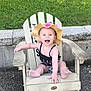 baby, child, outdoor, grass, chair, wooden_chair, hat, sunhat, smiling, happy, sitting, swimsuit, leopard_print, concrete, stone_wall, summer, cute, infant, person, playful