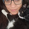 Luna joined the competition — help win amazing prizes! woman, glasses, cat, black_and_white_cat, pet, snuggling, close_up, portrait, indoor, cozy, furry, face, eyewear, whiskers, animal, cute, relaxed, companion, human, affection