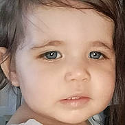 Dany joined the competition — help win amazing prizes! baby, background_blur, blue_eyes, child, close_up, curious, cute, expression, face, floral_pattern, hair, indoor, person, pony_tail, portrait, skin, soft_light, toddler, white_dress, young_child