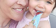 Danny participe au concours pour gagner de l'argent avec cette photo : arm, child, closeup, face, family, hair, happy, indoor, jewelry, love, nose_ring, packet, pink_clothing, portrait, selfie, skin, smile, snack, toddler, woman