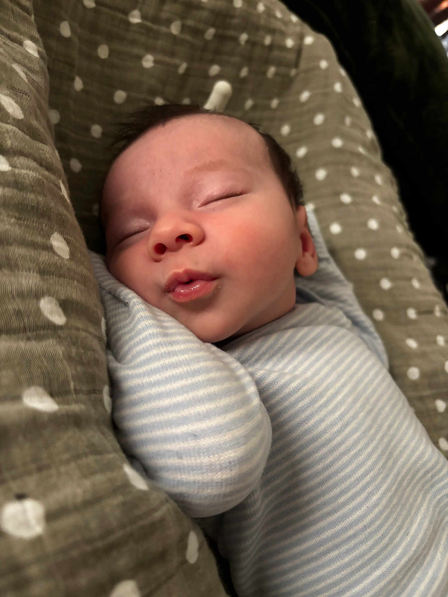 August joined the competition — help win amazing prizes! baby, newborn, sleeping, blanket, striped_clothing, pillow, polka_dot, infant, face, peaceful, cozy, swaddled, cute, child, soft, resting, closeup, indoors, person, wrapped